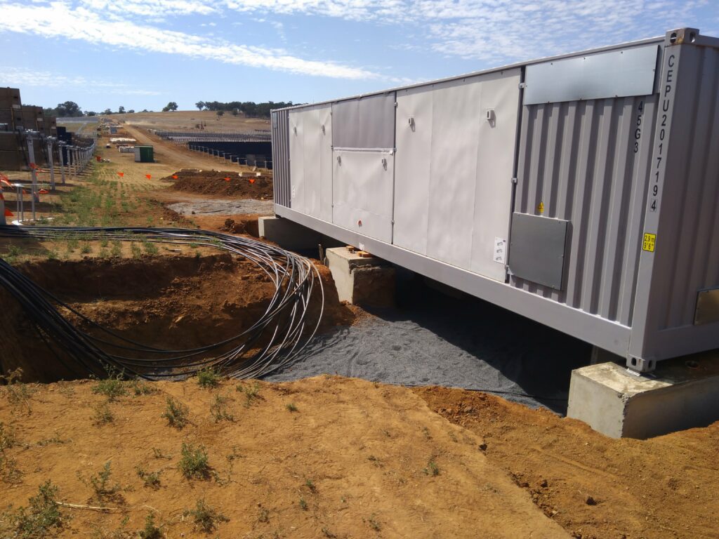 utility scale solar inverter with cables on a solar farm